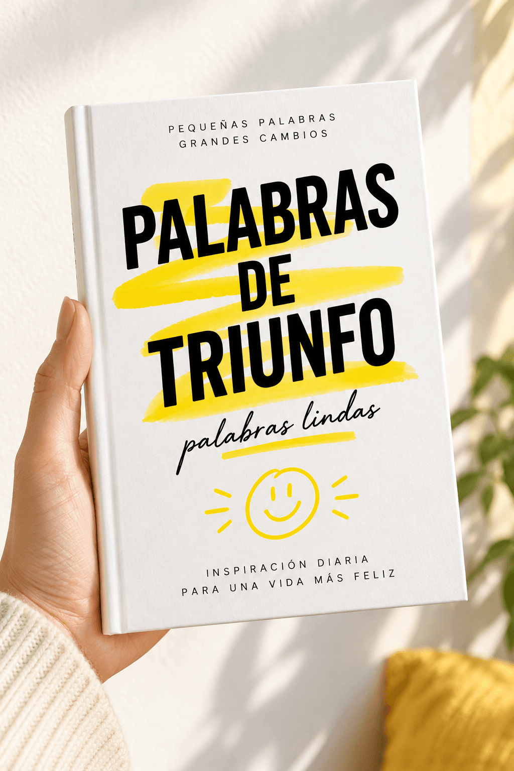 Libro Palabras de Triunfo con la nueva portada sostenido en la mano